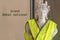 Marianne symbol of the French Republic with a yellow vest gilet jaune with the text Great national debate written in French