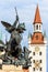 Marienplatz Square detail, Munich, Germany. Statue of angel closeup on background of Altes Rathaus or Old Town Hall