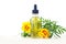 Marigold essential oil in beautiful bottle on White background