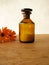 Marigold flowers and homeopathic pills in bottle