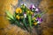 Marigold and orchid flowers in brass bowl