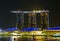 Marina Bay Sands hotel and bay waterfront dressed in beautiful lights at night ready to celebrate the country National Day