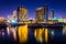 Marina and buildings reflecting at the Embarcadero at night in S