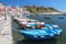 Marina Corricella with colourful boats and houses, Terra Murata, Procida Island, Bay of Naples, Italy.