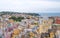 Marina Corricella, Italy, fishing village on the island of Procida with pastel coloured houses tumbling down the cliff to the se