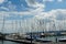 Marina with plenty of yachts and small boats covered with canvas in Lake Constance or Bodensee