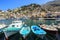 Marina at the small town Symi with boats and colorful houses