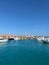 Marina view. Sea port. Yachts in port. Turrets on the horizon.