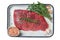 Marinatad flank beef steak with herbs and olive oil, raw meat. Isolated, white background.