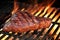 Marinated Beef Steak On The Flaming Hot BBQ Grill.