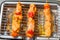 Marinated chicken brochette on electric barbecue