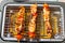 Marinated chicken brochette on electric barbecue
