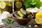 Marinated cucumbers gherkins. Pickles marinated with lemon and garlic on the kitchen wooden table