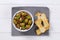 Marinated green olives with toasts
