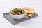 Marinated green olives with toasts