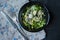 Marinated herring with arugula, onions, boiled quail eggs and lemon juice and olive oil. Delicious salad. Proper nutrition. Dark