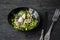 Marinated herring with arugula, onions, boiled quail eggs and lemon juice and olive oil. Delicious salad. Proper nutrition. Dark