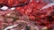 marinated meat for barbecue in display case of butcher shop, closeup view, fresh pork or beef pieces