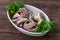 Marinated milk mushrooms with red onions and herbs