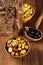 Marinated Olives in bowls with moroccan ornament on wood