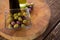 Marinated olives with olive oil and balsamic vinegar bottles on table