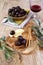 Marinated olives, slices of cheese and wineglass