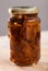 Marinated red pine mushrooms in closed jar