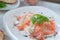 Marinated salmon carpaccio salad with basilic