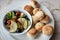 Marinated vegetables: olives, zucchini, tomatoes with yeast buns
