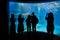 Marine aquarium with visitor silhouettes
