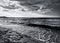 Marine beach with waves and clouds of storm sky