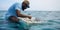 A marine biologist releasing tagged fish back into the ocean, contrasted against a research-focused backdrop, concept of