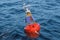 Marine buoy with solar panels in the open sea, 3D rendering