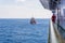 A marine captain monitoring an anchor handling tug boat maneuvering at offshore oil field