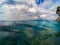 Marine landscape with transparent water and blue sky. Blue sea water look through.