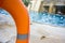 Marine lifebuoy on fence, near swimming pool