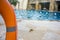 Marine lifebuoy on fence, near swimming pool