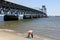 Marine Parkway Bridge, fisherman with a net on Brooklyn side of Rockaway Inlet, New York, NY, USA