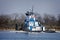 Marine push boat or tug boat in river with barge