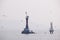 Marine rocky warning light in a foggy day at Istanbul Kartal