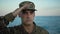 Marine soldier in uniform salutes