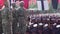 Marine soldiers in camouflage uniform stand alert on guard during military graduation rites