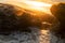 Marine swimming pool formed by rocks on the beach with beautiful sunset light. Namibe. Africa. Angola