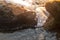 Marine swimming pool formed by rocks on the beach with beautiful sunset light. Namibe. Africa. Angola