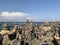 Marine theme: stones on the shore. The stones are stacked in a pyramid against the background of the sea. Pyramid of stones on the