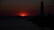 Marine timelapse silhouette of the coast and sea lighthouse with the movement of clouds in the evening 4k