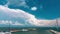 Marine Yacht Club pier for mooring boats, large white clouds fly over it time lapse.