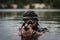 Marines combat swimmer aims with a pistol, in the water, close-up photo