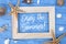 Maritime decoration with star fish, shells on blue weathered wood with slogan Enjoy the summe