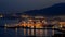 Maritime port of Malaga Spain at night with the city of Malaga in the background